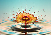 A drop of colored water splashing